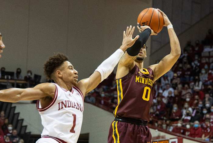 Rob Phinisee tries to block the ball from a Minnesota Golden Gopher.